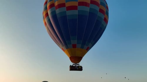 Hot Air Balloons Fly Over the Mountainous Landscape of Cappadocia Turkey
