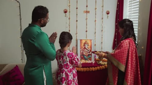 Family Standing in Prayer