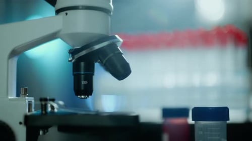 Close Up of a Optical Scientific Microscope in Laboratory Science Research Technology and