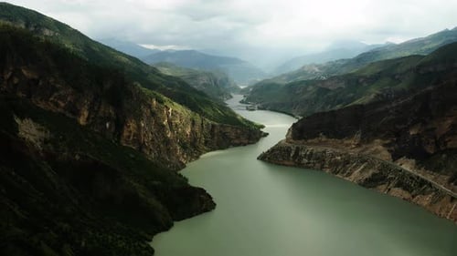 A Mountainous Landscape Where a River Flows in the Middle of the Mountains Aerial Photography of