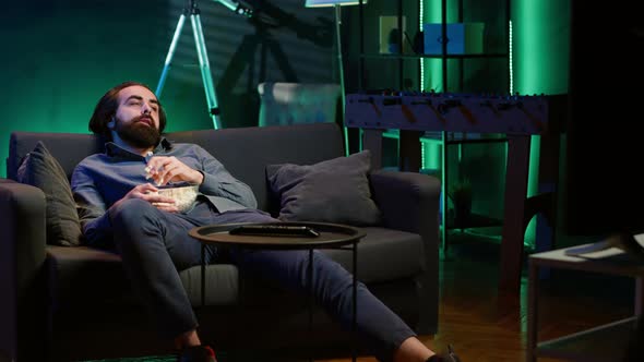 Bored Man at Home Slacking Off Entertaining Himself By Throwing Popcorn ...