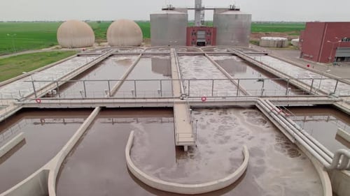 Aerial Drone Approaches Large Circulation Tanks of Water Treatment Plant