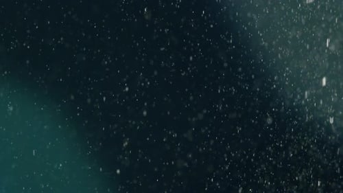 Arctic Sammlung: Schneefall mit einem großen blauen Flare-Effekt, der aus der oberen rechten Ecke und dem b kommt