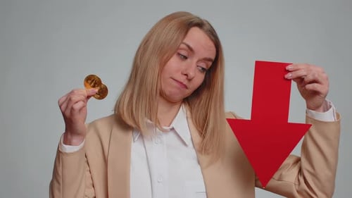 Woman Showing Bitcoins BTC Down Sign Decrease of Exchange Rate Fall of Stock Cryptocurrency Market