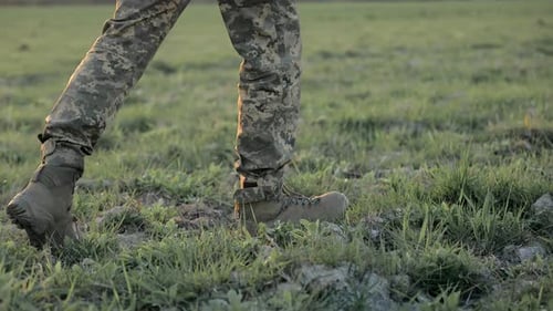 Closeup of Soldier's Boots on Field Military Boots on the Grass Capturing the Detail and Texture of