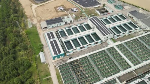 Aerial View of Water Treatment Facility with Solar Panels