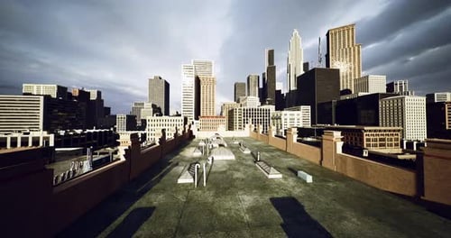 Urban Rooftop View Showcasing a City Skyline Under Dramatic Clouds
