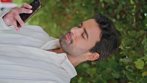 Sexy Brunette Reading Mobile Phone Message Garden Vertical Closeup Man Waiting