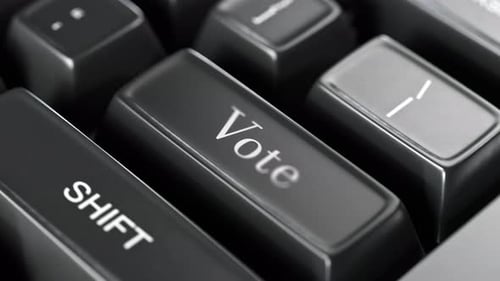 Black keyboard key with the red word "VOTE" symbolizing the importance of voting