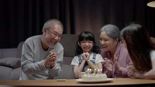 Family Surprises Young Girl with Birthday Cake