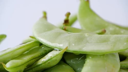 Beautiful close up of green fresh peas and pea pod.