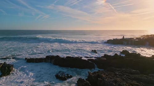 Stormy Sea Waves Splashing at Rough Seashore Rocks Slow Motion. Aerial View Beautiful Foamy Ocean...