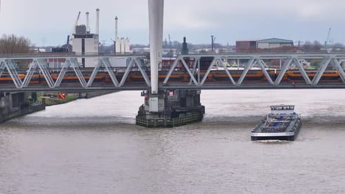 Train bridge at Dordrecht spans across the water as vessel goes under