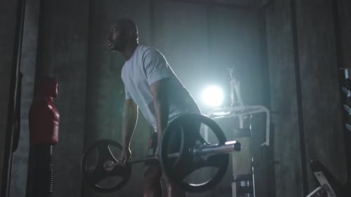 Man Weightlifting in Gym for Strength Training