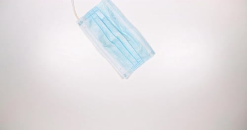 Surgical Mask on a White Surface