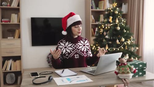 Woman Wearing Santa Hat on Video Call