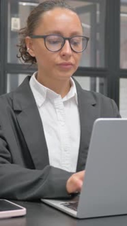 Hispanic Business Woman having Neck Fatigue and Pain in Office, vertical video