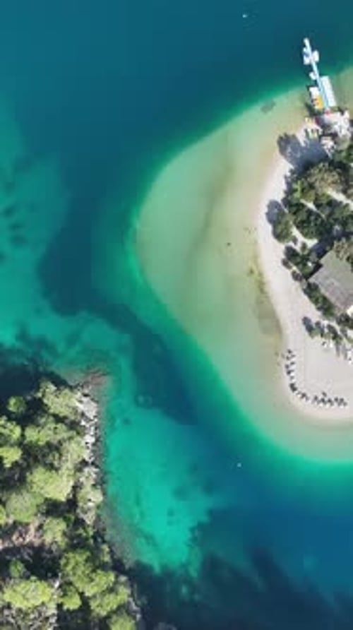 Vertical aerial of beach and sea harmony