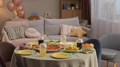 Birthday Party Table Setting With Pizza and Cake