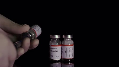 Taking Vaccine from Vial with Syringe