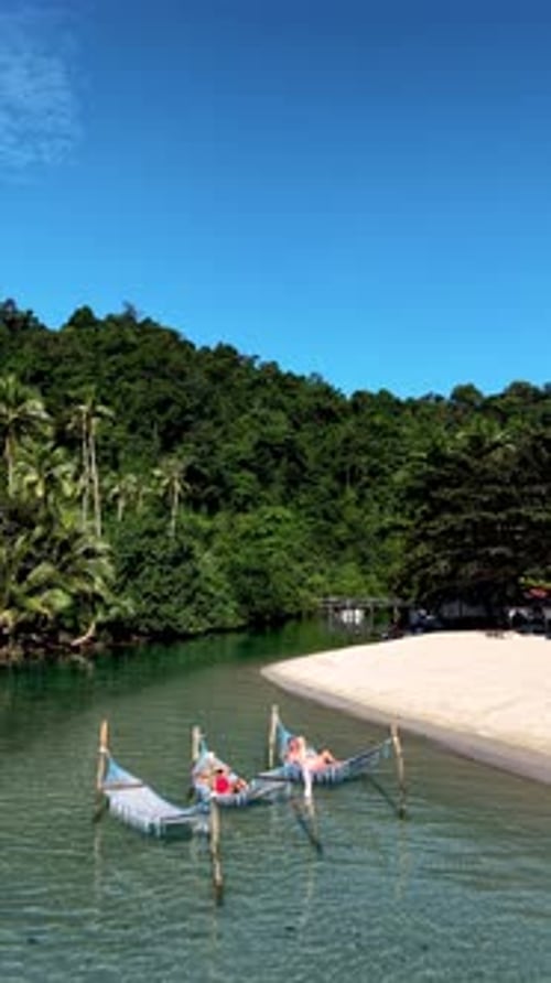 Relaxing on a Hammock in the Serene Waters of Koh Kood Island Thailand