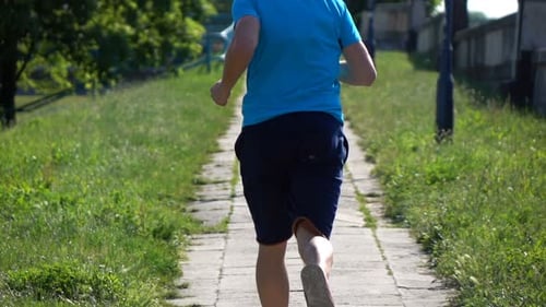 Young, Sporty Man Jogging in City Park, Super 240