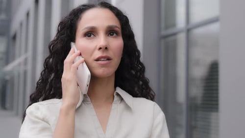 Serious Businesswoman Standing Outdoors in City Woman Talking Mobile Phone Call Gadget Online