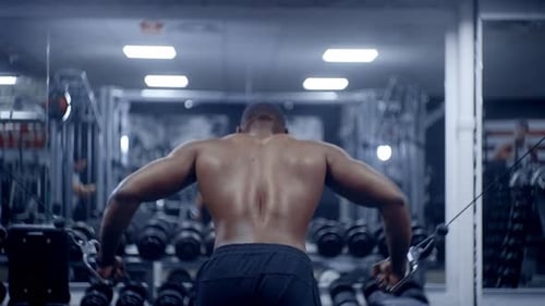 Athletic African American man completes chest fly set