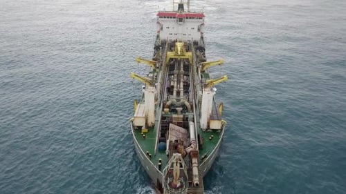 Trailing Suction Hopper-Dredger ship roaring across the sea