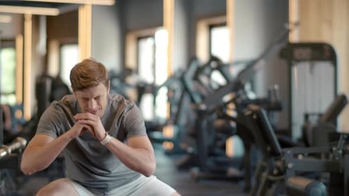 Closeup Fitness Man Doing Squats in Sport Club. Sport Man Exercising In