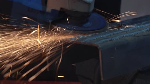 Technician Use Electric Rotate Grinder for Cutting and Grinding Structure Metal Material