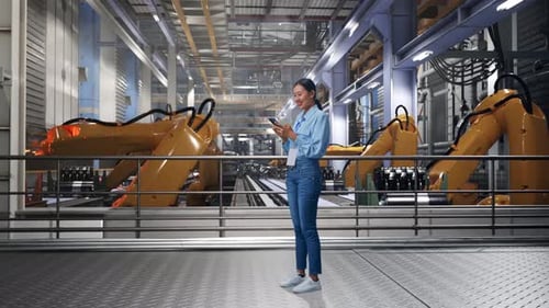 Asia Professional Female Works On Her Phone With Robotic Arms
