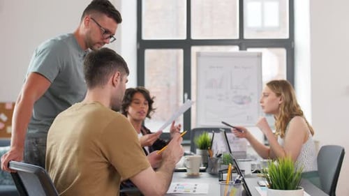 Creative team of young business people working together at the office