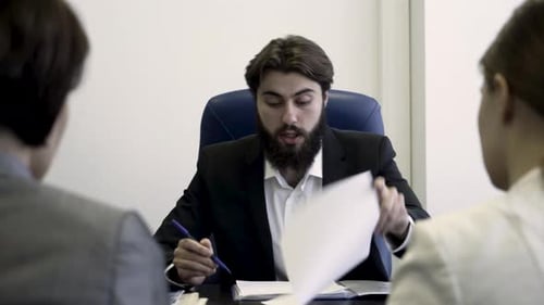 A Business Meeting in a Corporate Office Focusing on Key Objectives and Strategies