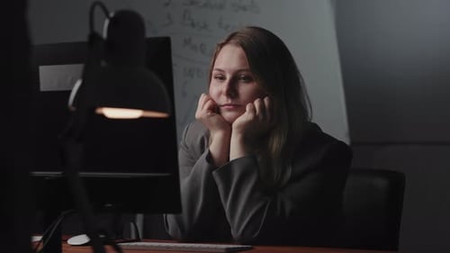 Woman with Fair Hair Working at her Desk