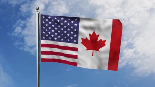 United States and Canada Flags Waving in Wind