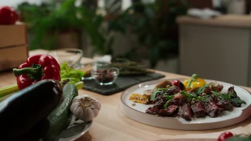 Prepared Steak with Vegetables on Plate in Kitchen