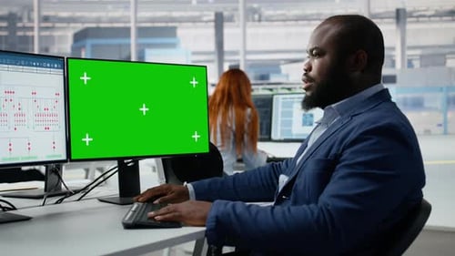Green Screen Mockup PC Used By Man in Semiconductors Factory Office