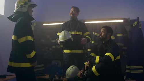 Firefighters celebrate successful emergency rescue in fire station
