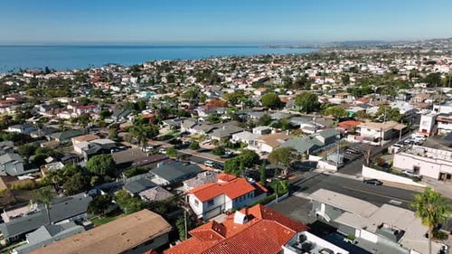 Aerial view of San Clemente coastline city with nice luxury and wealthy homes on a clear sunny day.