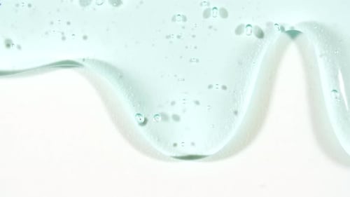 Cosmetic Gel Fluid With Molecule Bubbles Flowing On The Plain White Background Liquid Cream Gel