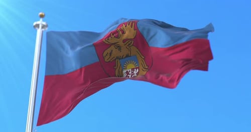 Realistic Flag with Moose Coat of Arms Waving in Bright Sky