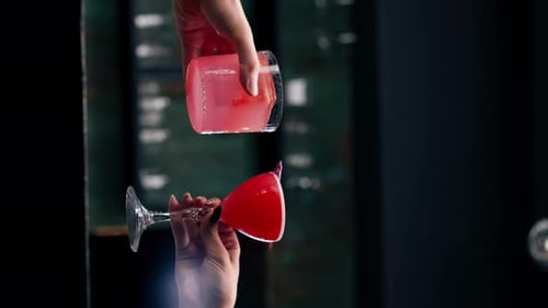 Vertical Video Close Up of Two People Cheering Cocktails in Bar or Disco Club Drinks and Cocktails