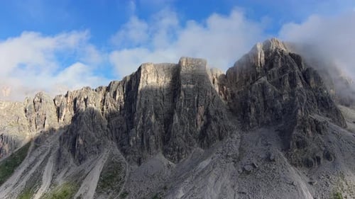 Dramatic aerial flight over the Croda da Lago mountain range in the Dolomites