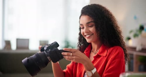 Home office, photographer and woman with smile, camera and review for quality control