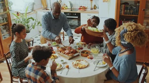 Family Gathering for Meal in Bright Kitchen