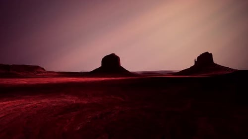 Two Red Rocks in Desert