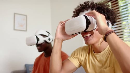 Young Adults Enjoying Virtual Reality Experience at Home