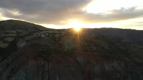 Aerial View Of Village On Mountain Slope At Sunrise