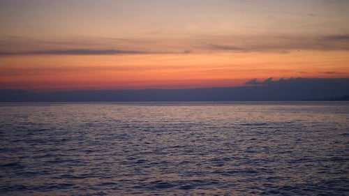 A Stunning Ocean Sunset Paired with a Vibrant Sky Bringing Serenity and Calmness